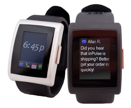 A pair of inPulse watches, one displaying the time, the other displaying the body of an email.